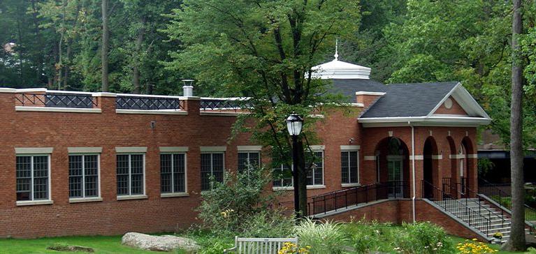 An outside view of a Chase Collegiate building in the springtime.